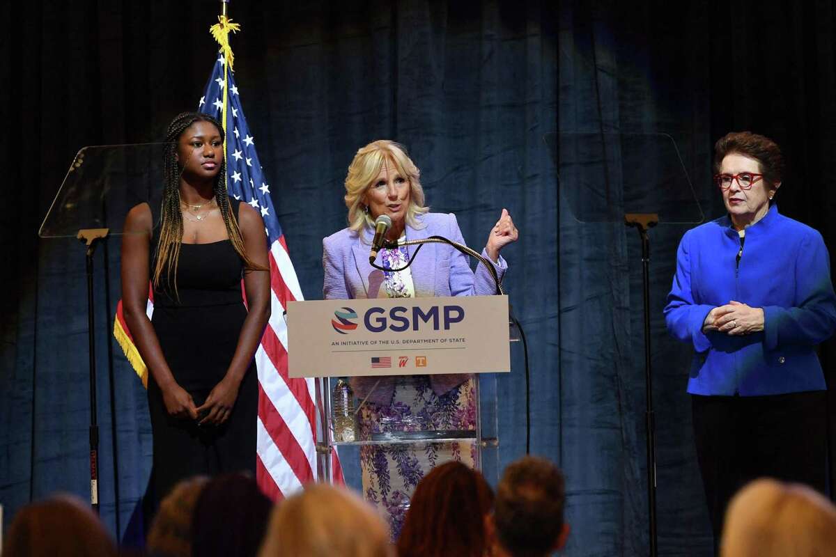 Tennis legend Billie Jean King, right, and high school track athlete Maya Mosley, left, listen Wednesday to First Lady Jill Biden speak during an event in Washington, D.C., to mark the 50th anniversary of Title IX.