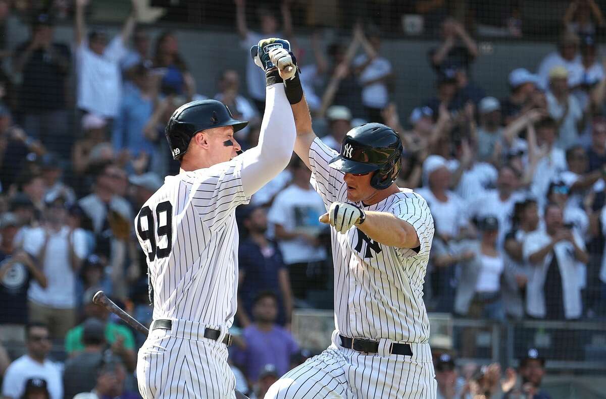 NEW YORK, NEW YORK - JUNE 26: DJ LeMahieu #26 of the New York Yankees celebrates with Aaron Judge #99 after hitting an eighth inning two run home run against the Houston Astros during their game at Yankee Stadium on June 26, 2022 in New York City. (Photo by Al Bello/Getty Images)