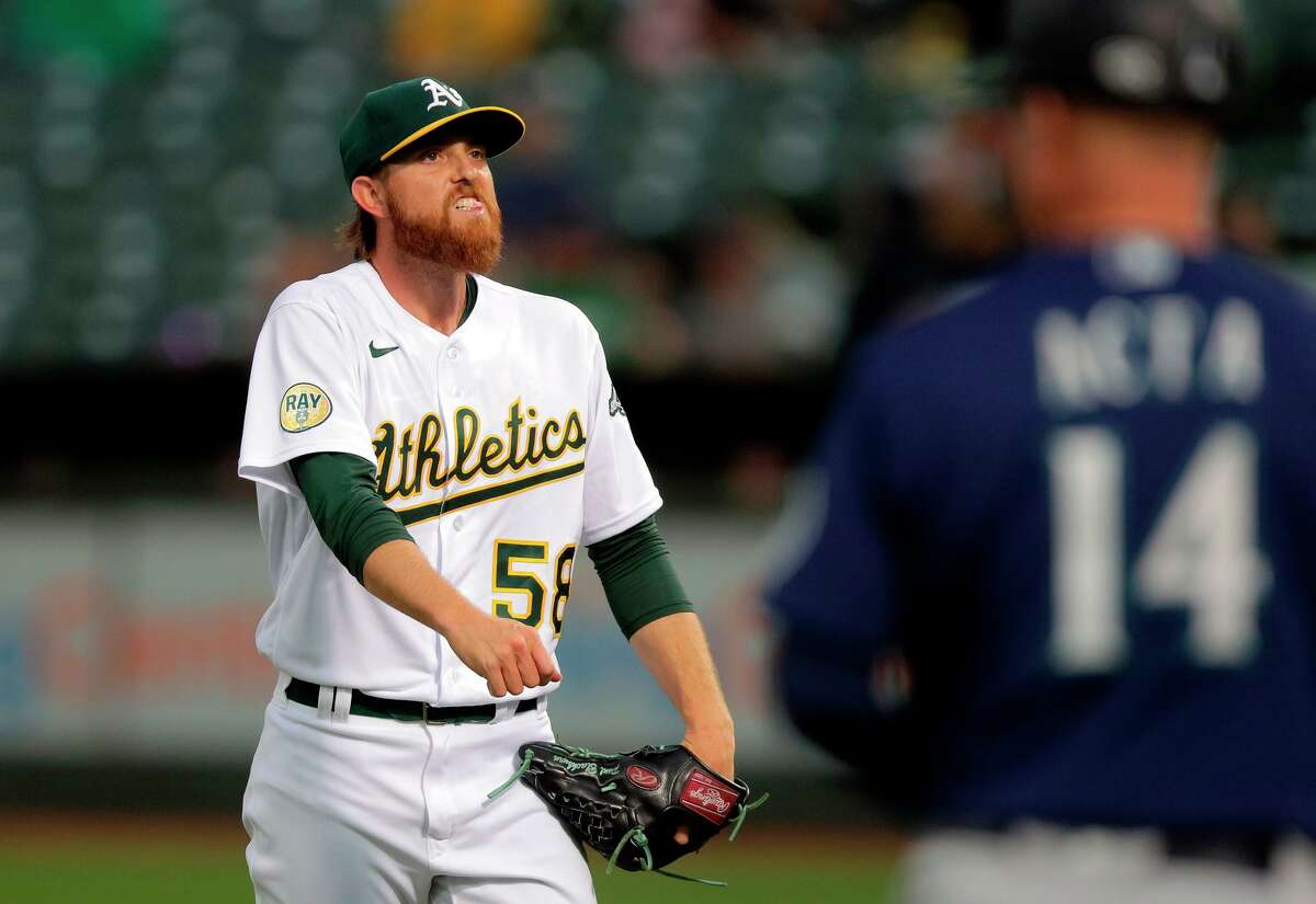 Paul Blackburn reacts after striking out Adam Frazier with the bases loaded in the third as the Oakland Athletics played the Seattle Mariners at the Coliseum on June 22.