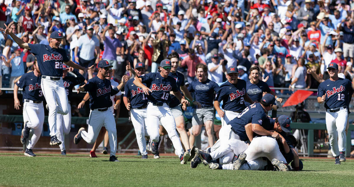 Mississippi players dogpile following their victory over Oklahoma to win Game 2 of the NCAA College World Series baseball finals, Sunday, June 26, 2022, in Omaha, Neb. (AP Photo/Rebecca S. Gratz)