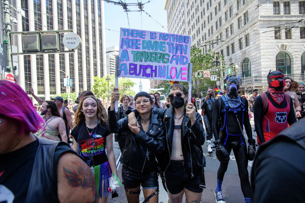 Participants hold a sign during the the San Francisco Pride parade in San Francisco, Calif.  on June 26, 2022.