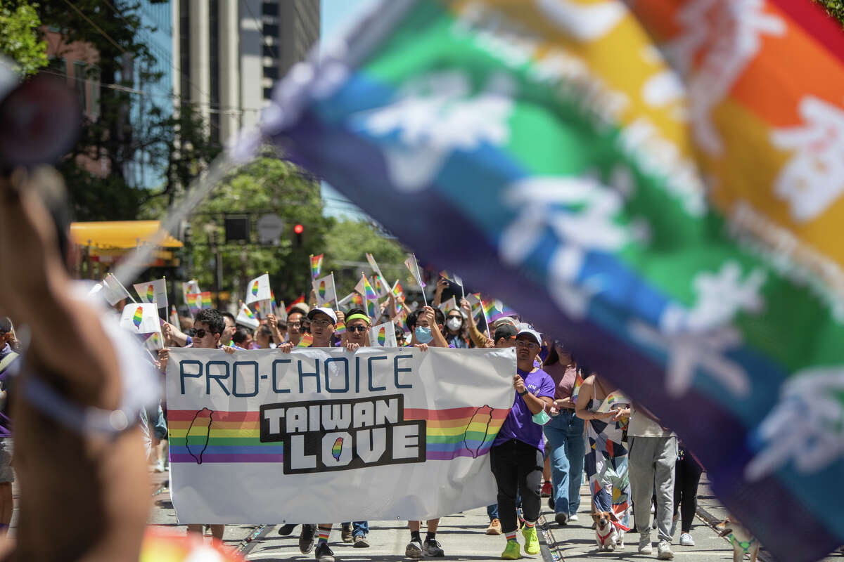 Participants take part in the San Francisco Pride parade in San Francisco, Calif.  on June 26, 2022.