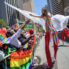 A costumed participant walking on stilts greets the crowd during the San Francisco Pride parade in San Francisco, Calif. on June 26, 2022.