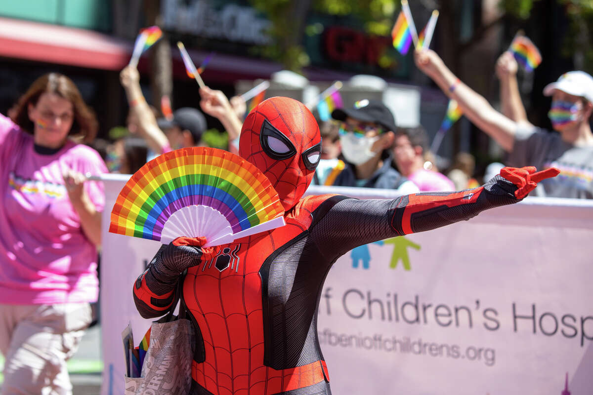 A participant dressed in a Spider Man outfit presents to spin webs during the San Francisco Pride parade in San Francisco, Calif. on June 26, 2022.