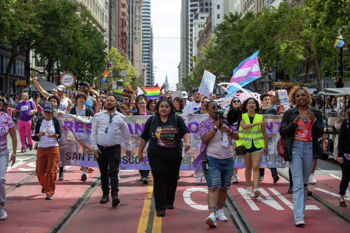 Participants walk down Market Street during the San Francisco Pride parade in San Francisco, Calif.  on June 26, 2022.