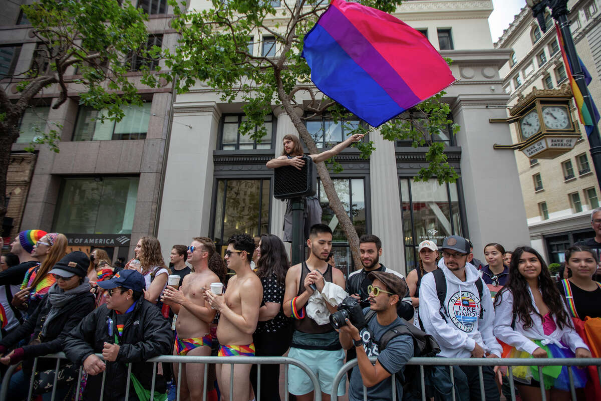 A spectator waves a flag during the San Francisco Pride parade in San Francisco, Calif.  on June 26, 2022.