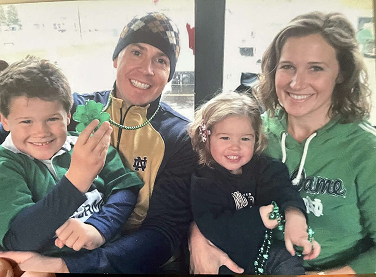 Edwardsville graduate Kristen (Boedeker) Fries and her husband, Mike Fries, with their son, Matty, and their daughter, Avery, at the University of Notre Dame. Kristen and Mike both graduated from Notre Dame.
