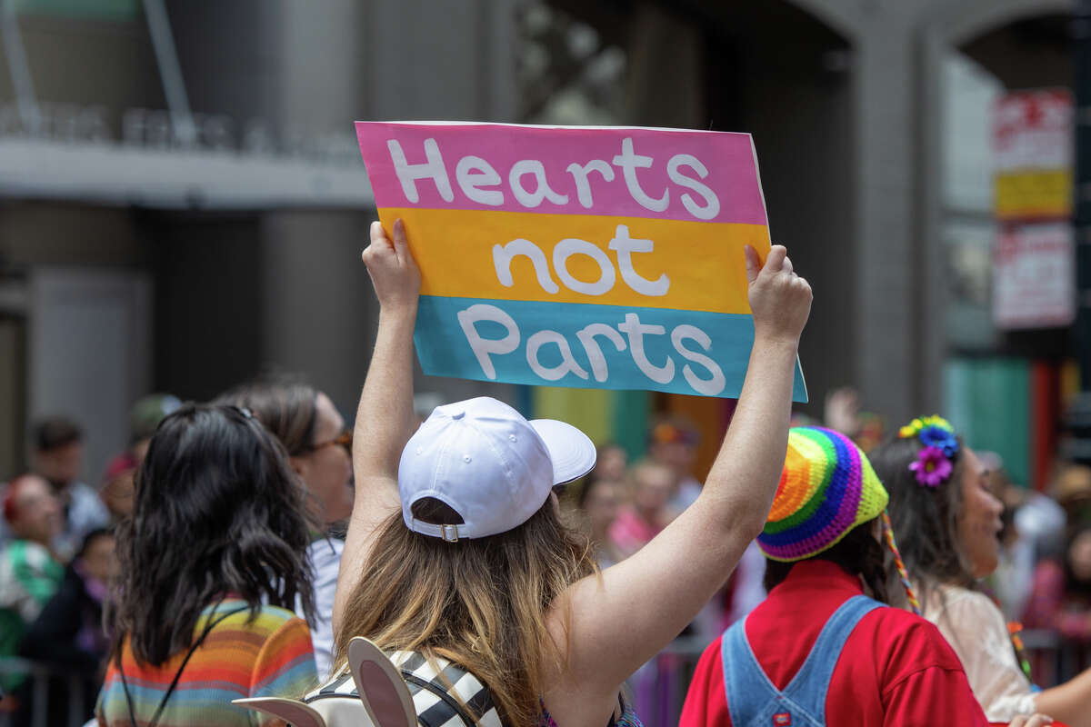 A participant holds a sign during the San Francisco Pride Parade in San Francisco, California on June 26, 2022.