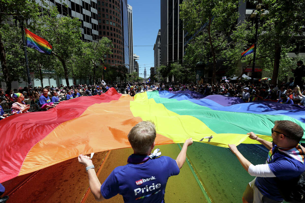 Marchers carry an oversized rainbow flag during the 52nd Annual San Francisco Pride Parade on June 26, 2022 in San Francisco, Calif. 