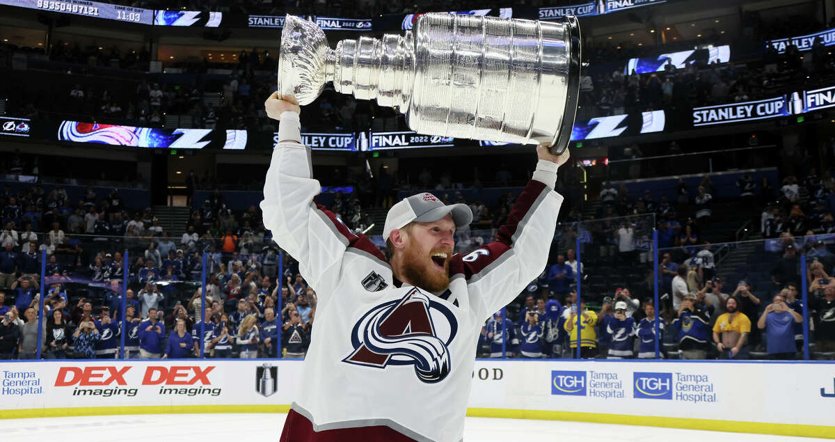 Gabriel Landeskog #92 of the Colorado Avalanche lifts the Stanley Cup after defeating the Tampa Bay Lightning 2-1 in Game Six of the 2022 NHL Stanley Cup Final at Amalie Arena on June 26, 2022 in Tampa, Florida. (Photo by Bruce Bennett/Getty Images)