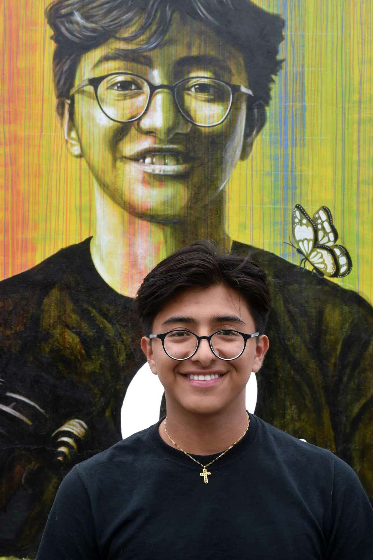 Camilo Bracho, 18, of Old Saybrook is one of six Old Saybrook Public School students incorporated into the mural, Just a Piece of Freedom, on the side of River Mart on Main Street in Old Saybrook on June 21, 2022.