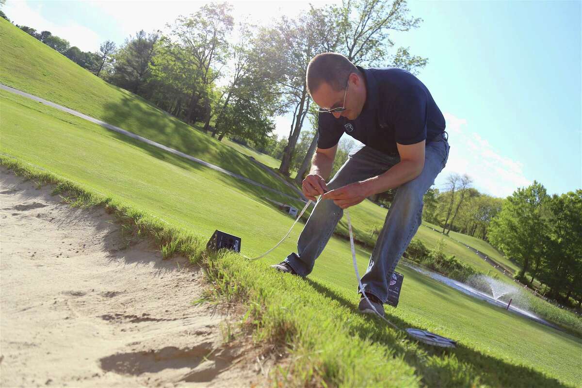 Anthony Calabrese, director of Parks & Rec, works on set-up at the H. Smith Richardson Golf Course on Friday, May 14, 2021, in Fairfield, Conn.