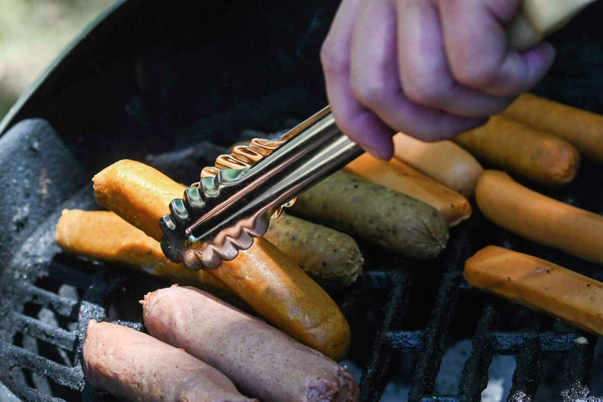 A variety of vegan hot dogs are put to the heat and taste test inside the Food Shack.