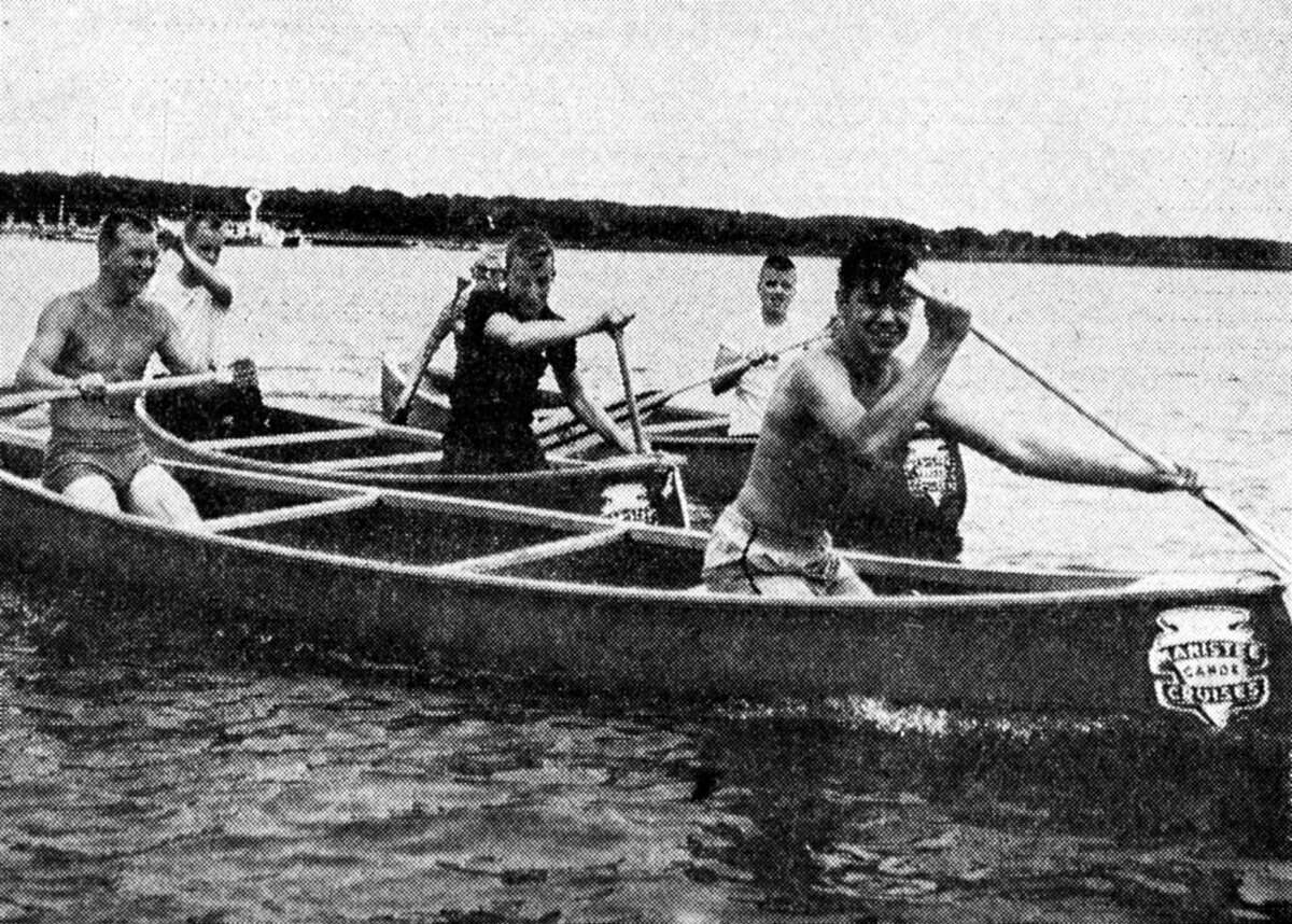 Manistee teenagers (front row, from left) Larry Meade and Gene Wittleff and (middle row) Wayne Johnson and Denny Cromer; (back row) John Bedingham and Gary Larson churn lake Michigan's water to a froth in preparation for a canoe race scheduled for 3 p.m. on July 3. The photo was published in the News Advocate on July 3, 1962.