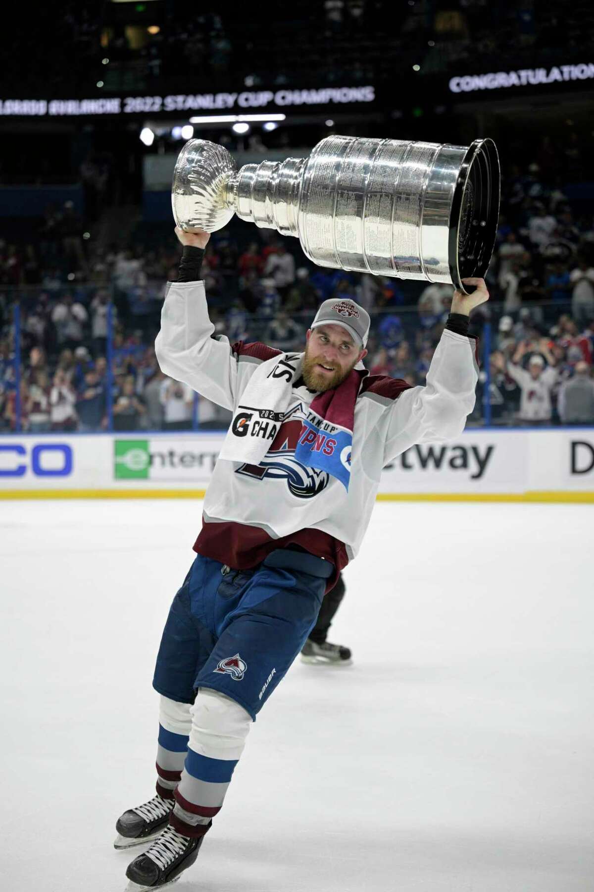 Avalanche defenseman Devon Toews, a Quinnipiac alum and former Bridgeport Sound Tiger, hoists the Stanley Cup after Colorado beat the Lightning 2-1 on Game 6 on Sunday night in Tampa, Fla.