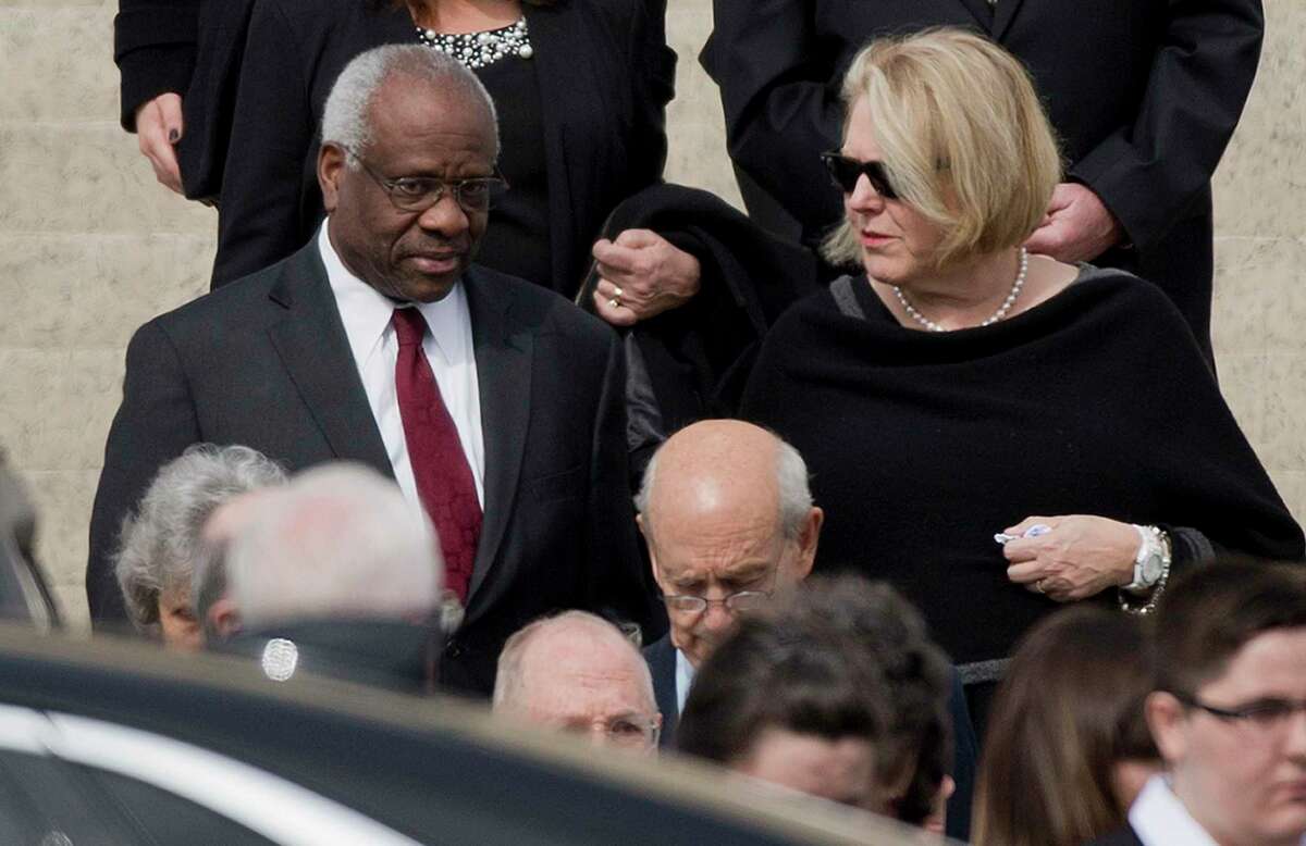 Supreme Court Justice Clarence Thomas and his wife Virginia Thomas leave the the Basilica of the National Shrine of the Immaculate Conception in Washington after attending funeral services of the late Supreme Court Justice Antonin Scalia in 2016.
