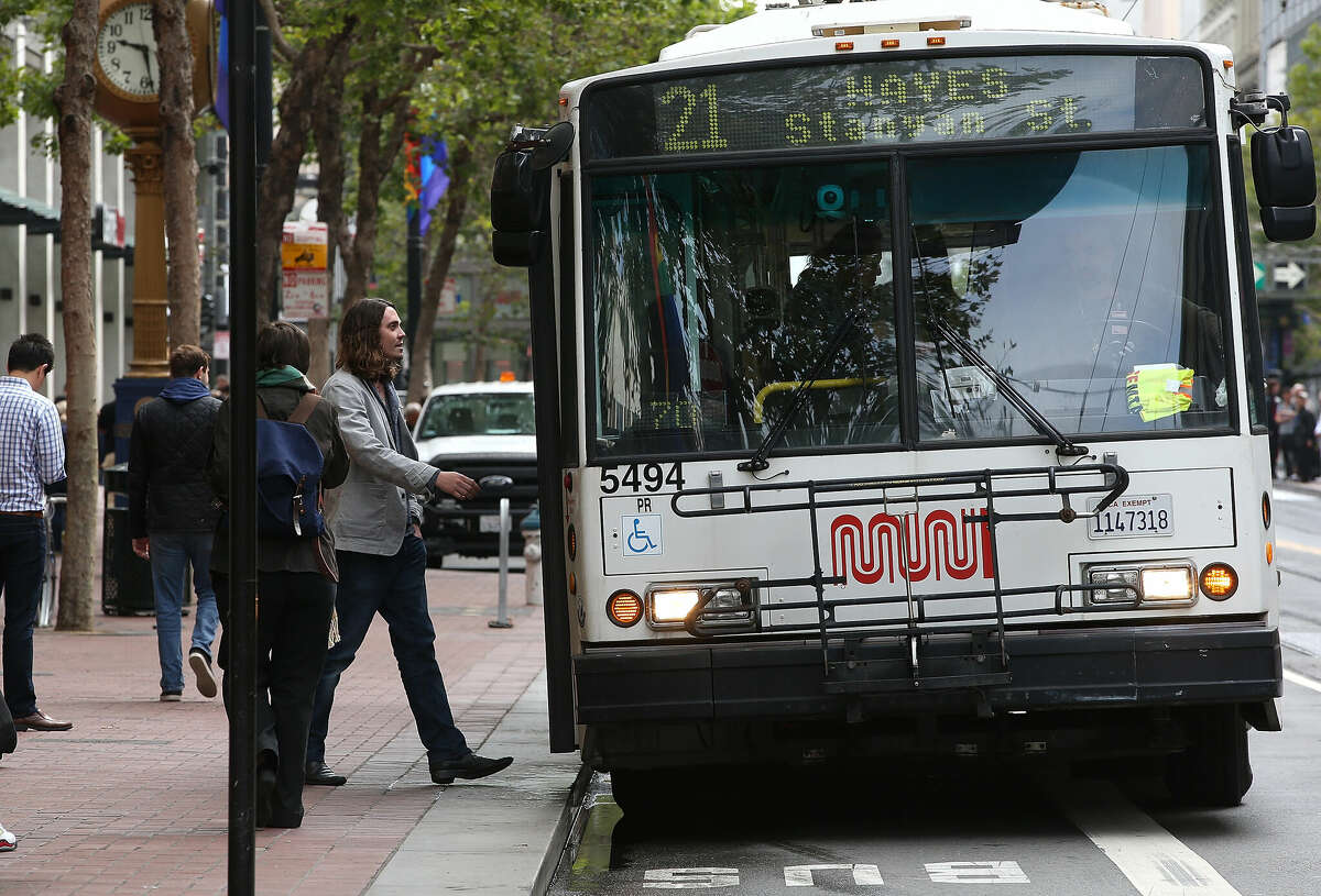 A passenger boards a 21 Hayes in June 2014.