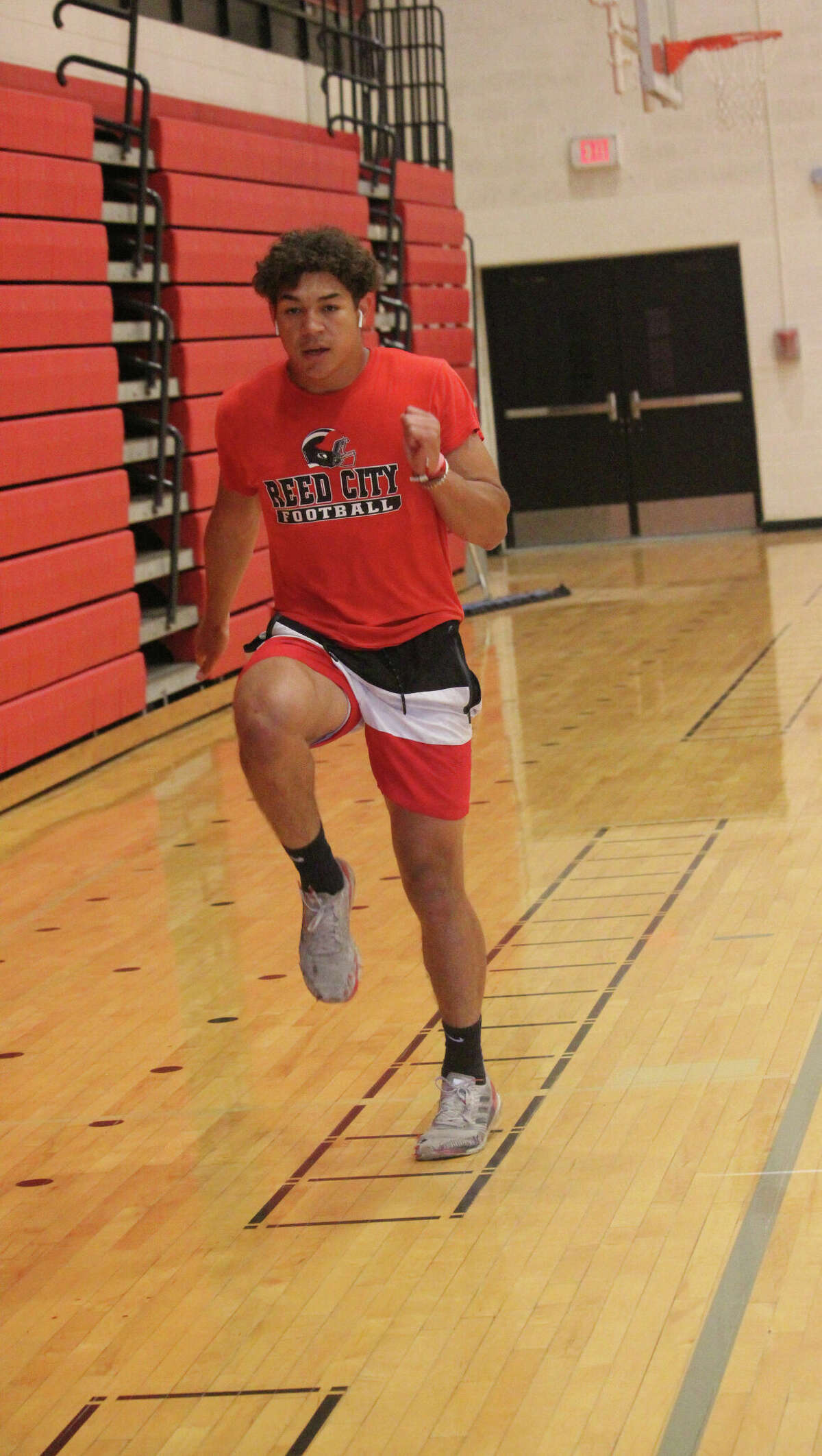 Bryson Hughes focuses on his footwork during a drill in the Reed City gymnasium last week.