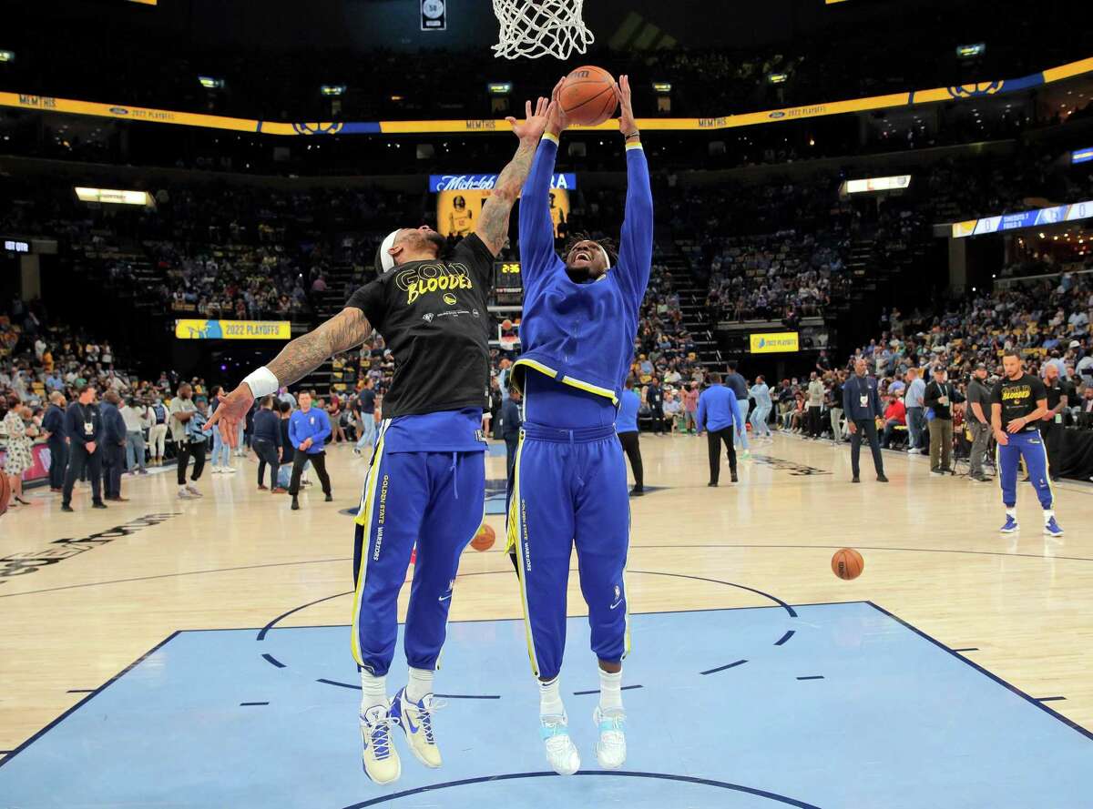 Kevon Looney (5) and Gary Payton II (0) grab for rebounds against each other before the Golden State Warriors played the Memphis Grizzlies in Game 1 of the second round of the NBA Playoffs at Fedex Forum in Memphis, Tenn., on Sunday, May 1, 2022.