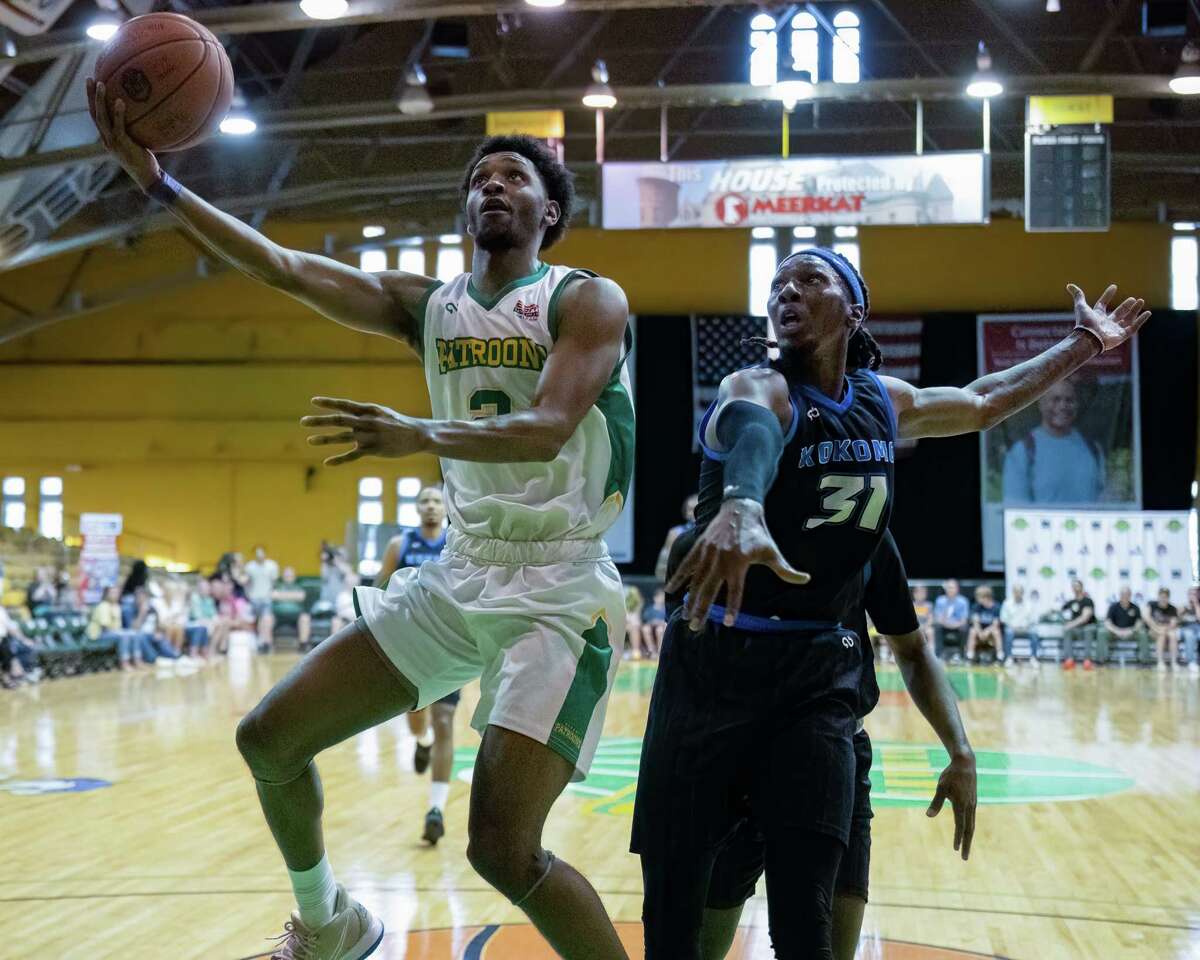 Albany Patroons guard AJ Mosby drives to the basket in front of Kokomo Bobcats forward Tremont Moore during The National Basketball League East Regional finals at the Washington Avenue Armory on Monday, June 27, 2022. (Jim Franco/Special to the Times Union)