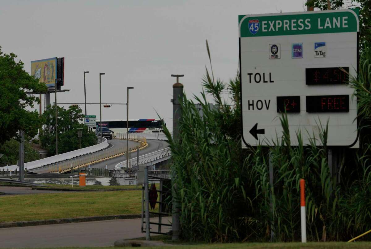 A Metropolitan Transit Authority bus passes by the entrance to the Interstate 45 high-occupancy toll lane from Monroe on Monday, June 27, 2022, in Houston. Metro will open the HOT lanes on weekends during the summer, under the same rules as Monday through Friday use.