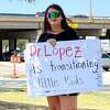 Kelly Neidert protests the work of Dr. Ximena Lopez near the University of Texas Southwestern Medical Center in Dallas earlier this month. 