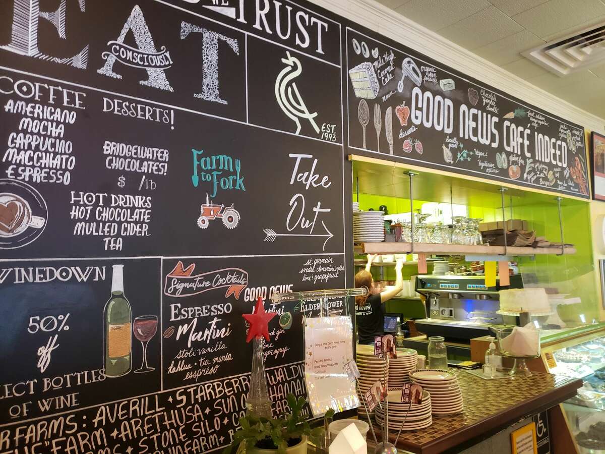 A wall-size blackboard tells the story of the Good News Restaurant and Bar in Woodbury.