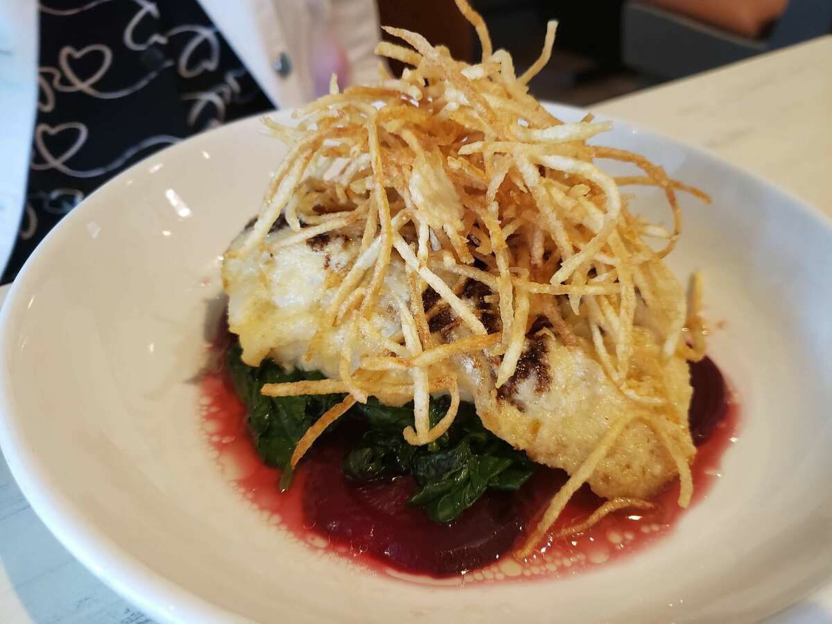 Horseradish Crusted Cod with beets, spinach and matchstick potatoes at Good News Restaurant in Woodbury.