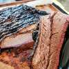 Slices of smoked brisket from Double A BBQ