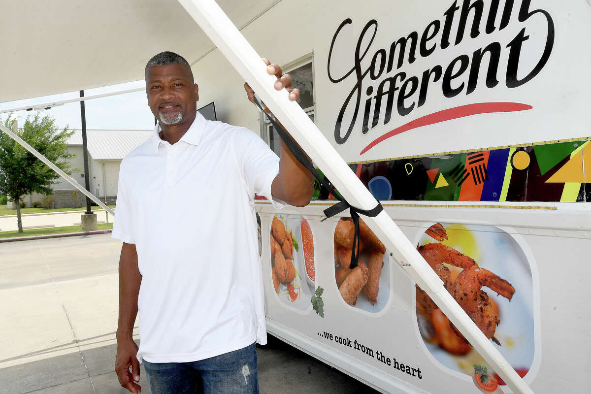 Port Arthur Rotary Club President Arthur Thomas stands near the Somethin Different food truck, which is among the local vendors joining in this Saturday's Taste of Summer fundraiser at the Carl Parker Center. Photo made Tuesday, June 28, 2022. Kim Brent/The Enterprise
