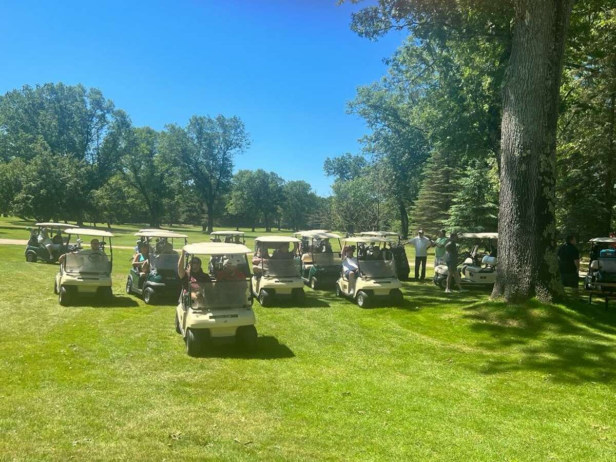 Golfers line up in their golf carts, receiving a blessing and enjoying an outing for a great cause at the annual lake County Habitat for Humanity golf outing this past weekend.