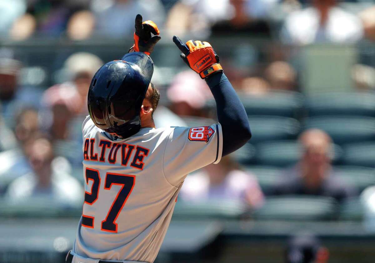 Houston Astros second baseman Jose Altuve (27) reacts after hitting a home run against the New York Yankees during the first inning of a baseball game, Sunday, June 26, 2022, in New York. (AP Photo/Noah K. Murray)