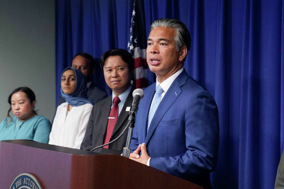 California Attorney General Rob Bonta, right, discusses the statewide rise in hate crimes at a news conference in Sacramento, Calif., Tuesday, June 28, 2022. Bonta said hate crimes in 2021 shot up 33% to nearly 1,800 reported incidents. That is the sixth highest tally on record and the highest since after the Sept. 11, 2001 terrorist attacks.