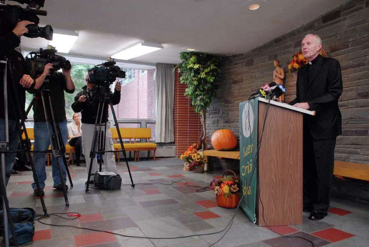 Bishop Howard Hubbard, right, addresses the media Monday at Mater Christi School in Albany. Officials from the Roman Catholic Diocese of Albany announced a plan to revitalize Catholic education in schools and parishes within the diocese. (Paul Buckowski / Times Union)