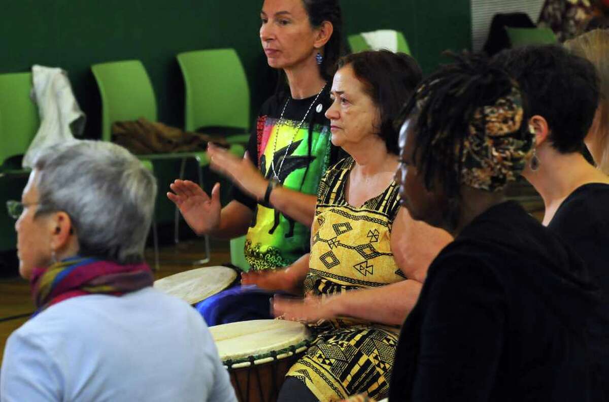 Participants play during a Djembe workshop during the two day "Abene to Albany" African Dance and Drum Festival at Green Tech High Charter School in Albany, NY on Sunday October 3, 2010 in Albany, NY. Petra Langner of Albany is second from left, and Gena Corea of Brattleboro, VT is third from left. ( Philip Kamrass / Times Union )