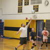 Baldwin volleyball coach Duane Roberts (left) works with his players during a camp session on Monday.