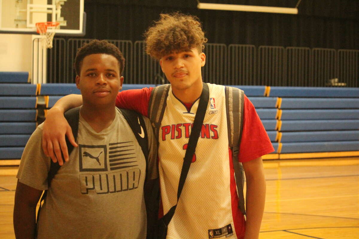 Brian Flowers (left) and Marcus Martin are football players who have been working out in the weight room.