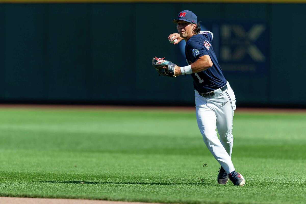 Mississippi second baseman Peyton Chatagnier throws to first in the seventh inning against Arkansas during an NCAA College World Series baseball game Thursday, June 23, 2022, in Omaha, Neb. (AP Photo/John Peterson)