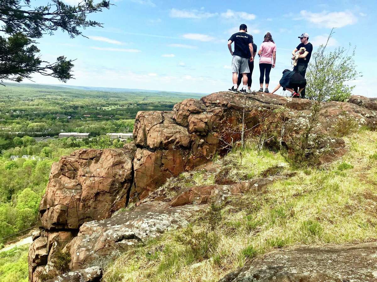 Hikers enjoy a sunny Sunday on Mt. Higby in Middlefield, on Connecticut’s portion of the Metacomet Ridge. The peak measures nearly 900 feet in height.