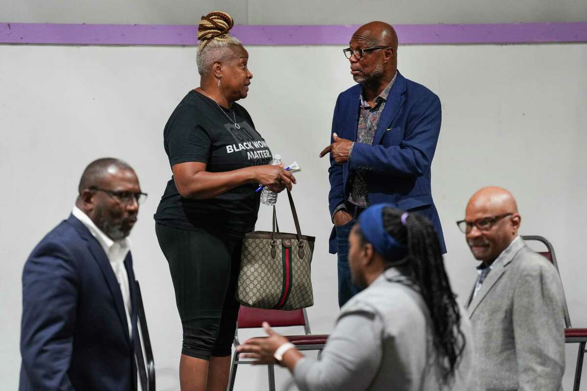 Pam Roberson, left, speaks to Bishop James Dixon following a news conference and community meeting at Greater Macedonia Baptist Church Monday, June 27, 2022 in Houston.