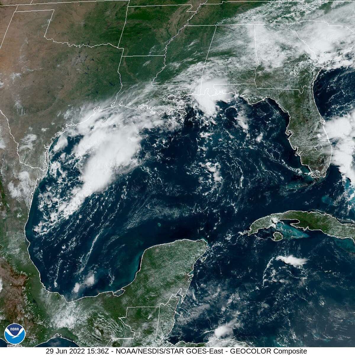 A tropical disturbance near the mid- to lower-Texas coast is partially to blame for increase rain chances in Houston this weekend. Here, the series of thunderstorms is seen from a NOAA satellite on Wednesday, June 29, 2022.
