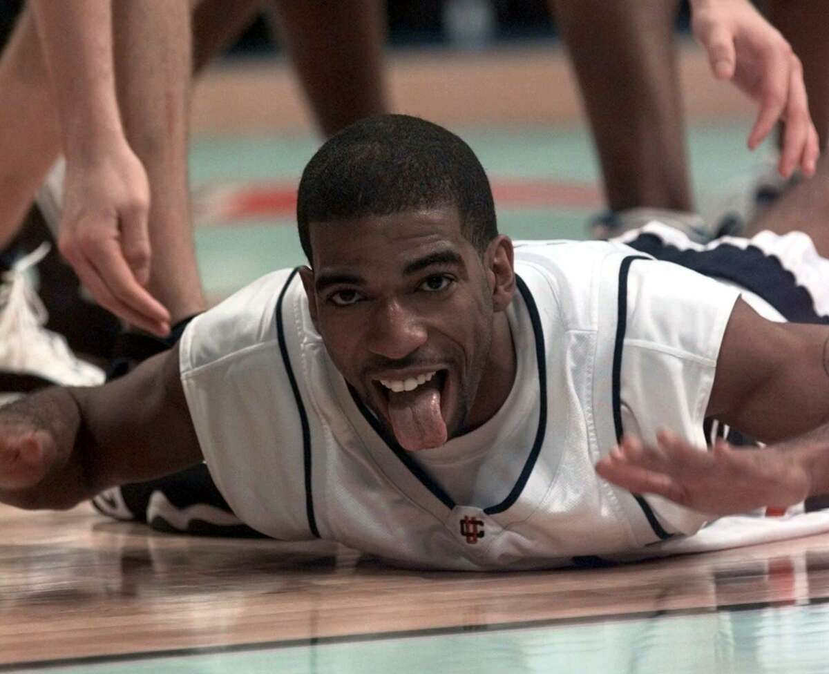 Connecticut's Richard Hamilton celebrates late in the second half against Duke in the championship game of the NCAA Final Four, Monday, March 29, 1999, at Tropicana Field in St. Petersburg, Fla. UConn went on to win 77-74. (AP Photo/Dave Martin) HOUCHRON CAPTION (03/30/1999): Most outstanding player Richard Hamilton was feeling anything but low after hitting the floor.