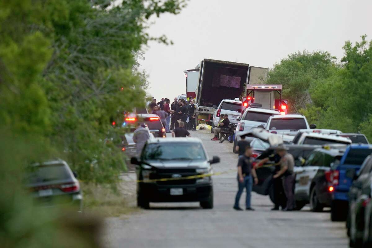Investigators at the scene where dozens of migrants were found dead Monday, June 27, 2022, in or near a tractor-trailer in San Antonio, Texas. The death toll rose to 51 on Wednesday. (Lisa Krantz/The New York Times)