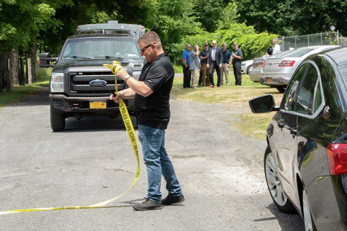 New York State Police are seen after searching the area at 85 Thompson St. after receiving a tip about the disappearance of Jaliek Rainwalker on Wednesday, June 29, 2022 in Troy, N.Y. Jaliek was last seen on November 1, 2007.