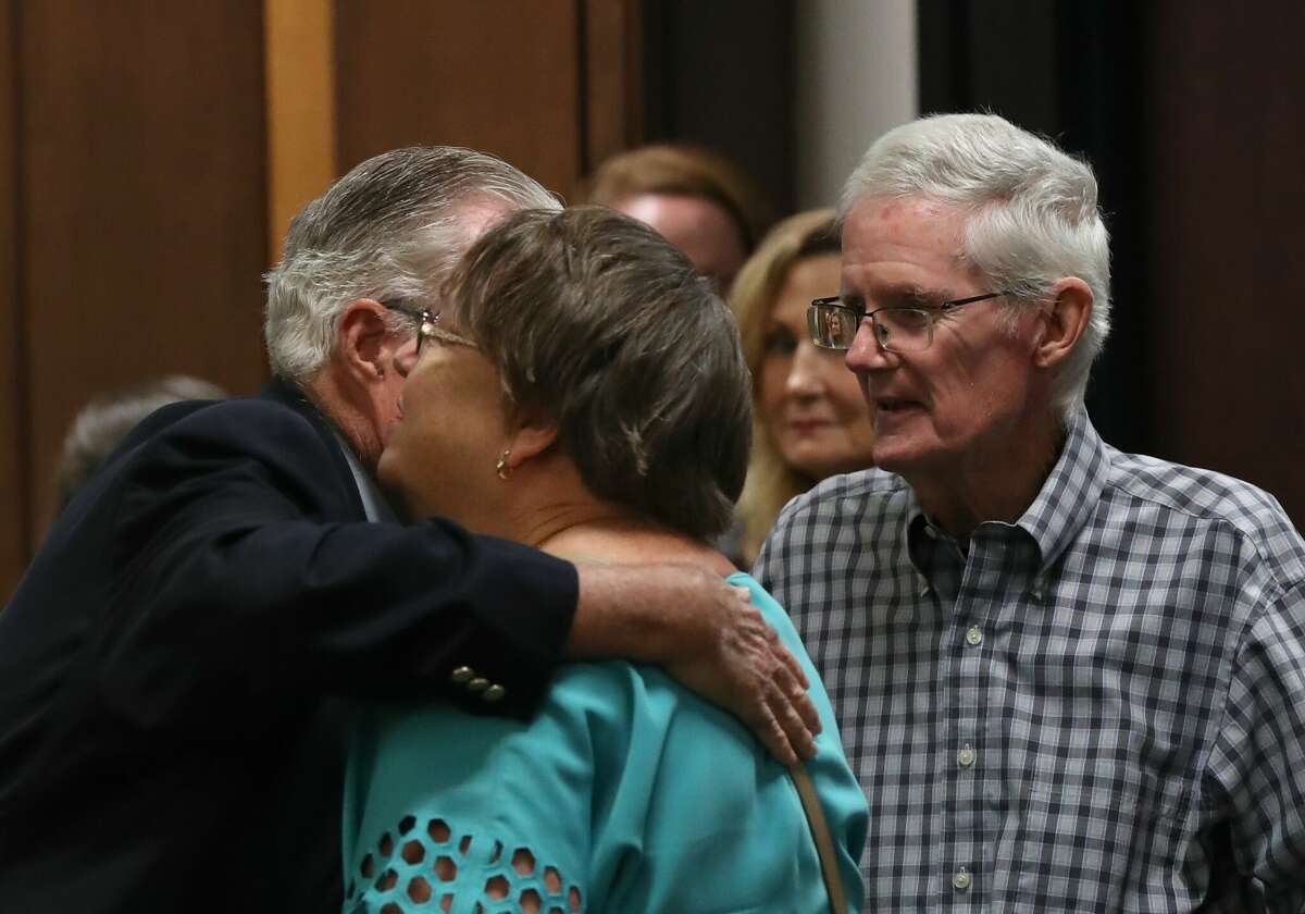 Bob Smither, right, father of Laura Kate Smither who was killed in 1997, and his wife, Gay, are consoled Wednesday, June 29, 2022, after William Reece pleaded guilty to two counts of felony murder in the 1997 deaths of Smither and Jessica Cain at the Galveston County Courthouse.