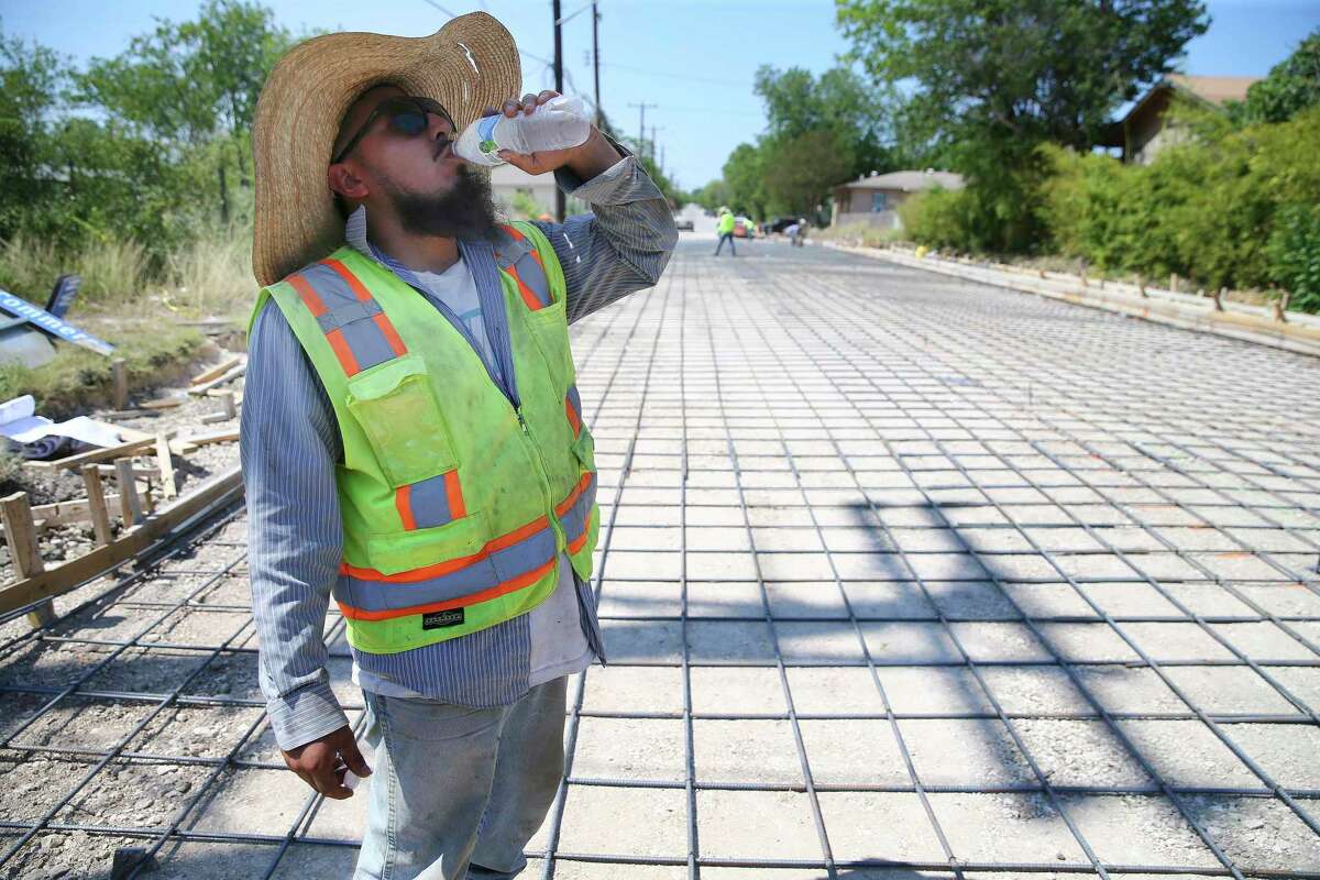 A man seeks shelter from the San Antonio heat. 
