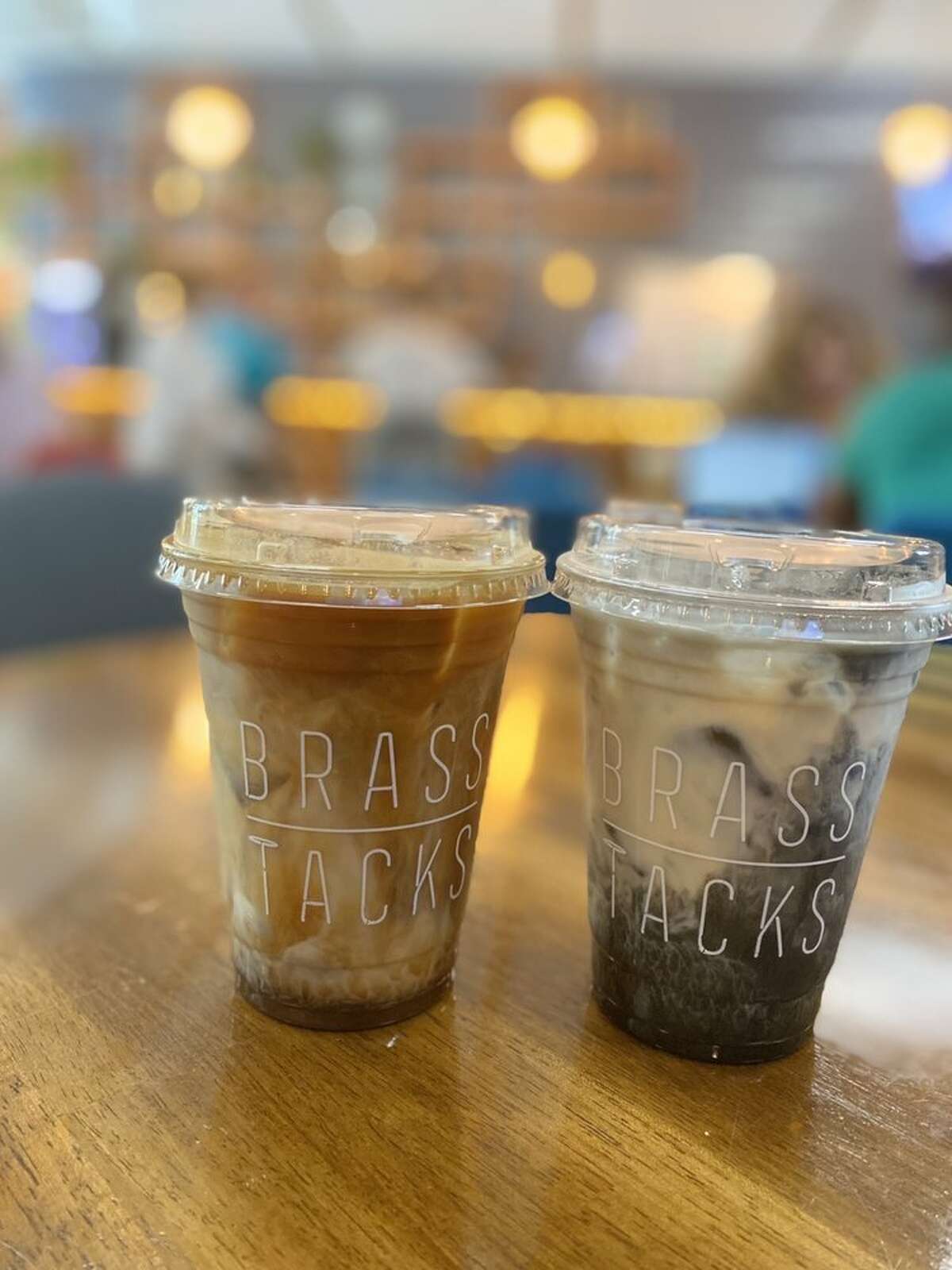 Lavender iced latte and charcoal iced latte at Brass Tacks.