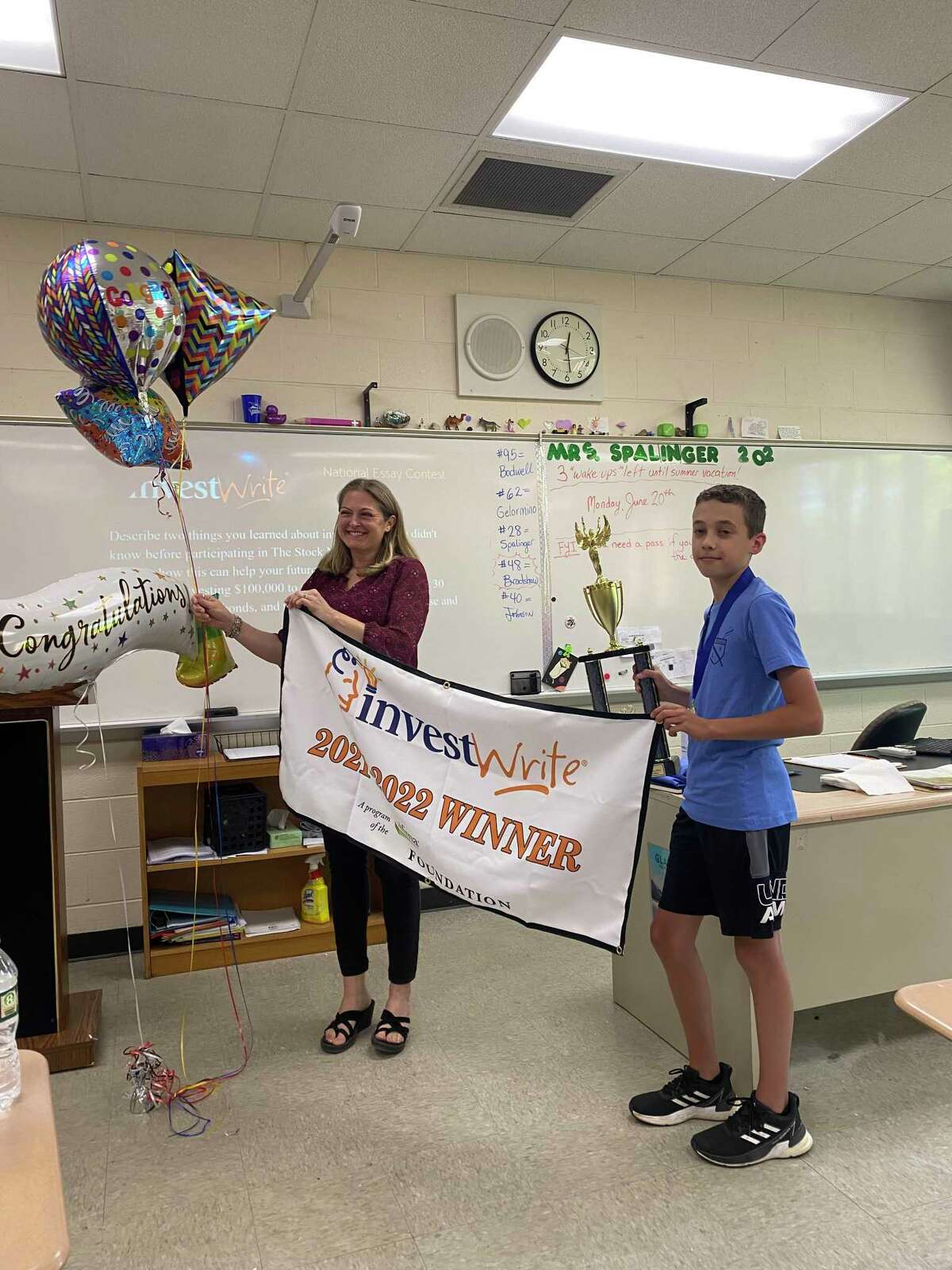 Torrington Middle School student Gabriel Mazzacane and his teacher, Suzanne Spalinger were honored by the SIFMA Foundation during a classroom presentation on June 20.