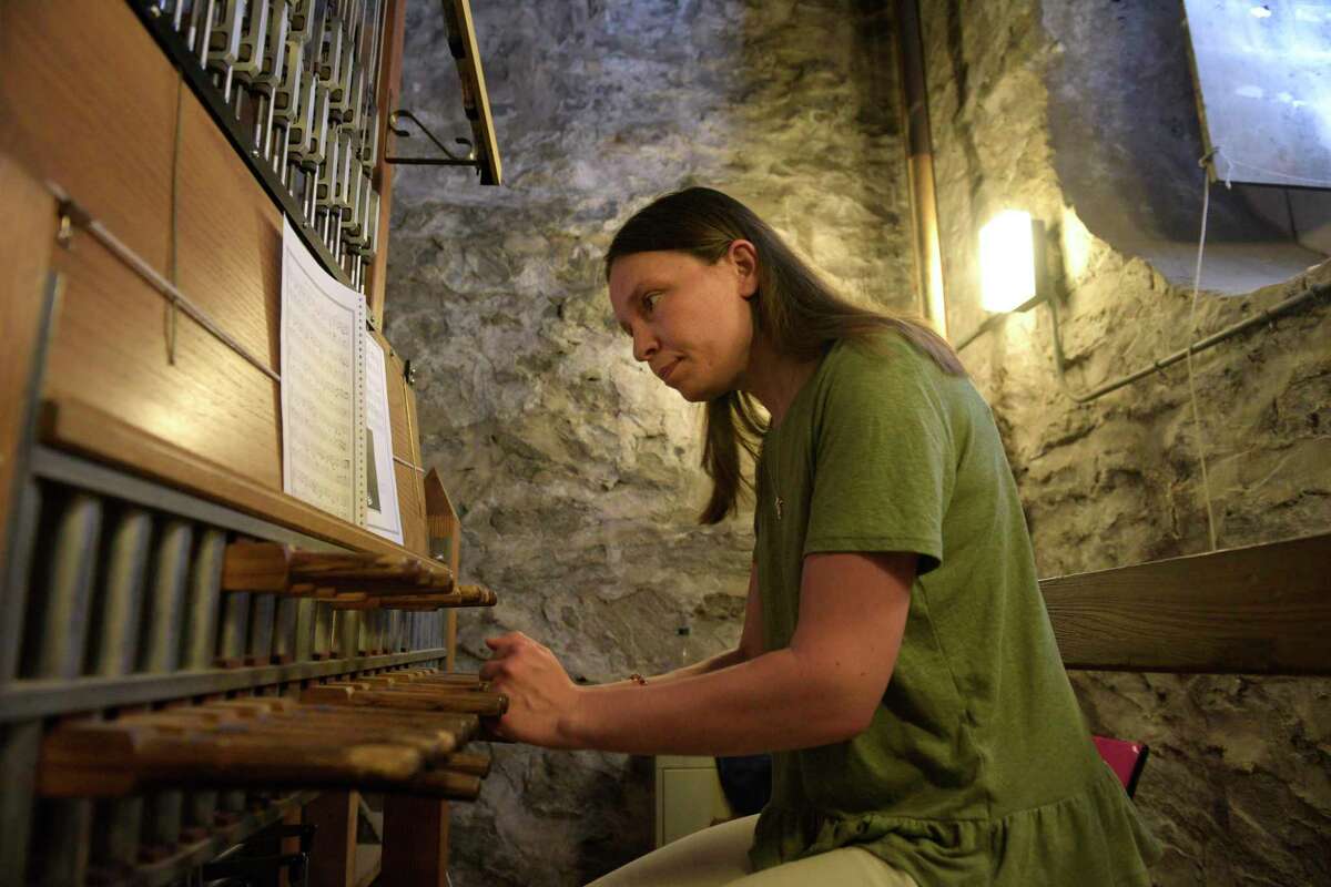 Tatiana Lukyanova practices on the carillon in St. James Episcopal Church steeple before the church’s first summer carillon concert on Wednesday, June 29, 2022. Lukyanova, of New Britain, is the organist and accompanist at the South United Methodist Church, in Manchester, carillonneur at the First Church of Christ Congregational in New Britain, and a carillonneur-in-residence at Storrs Congregational church. Danbury, Conn.