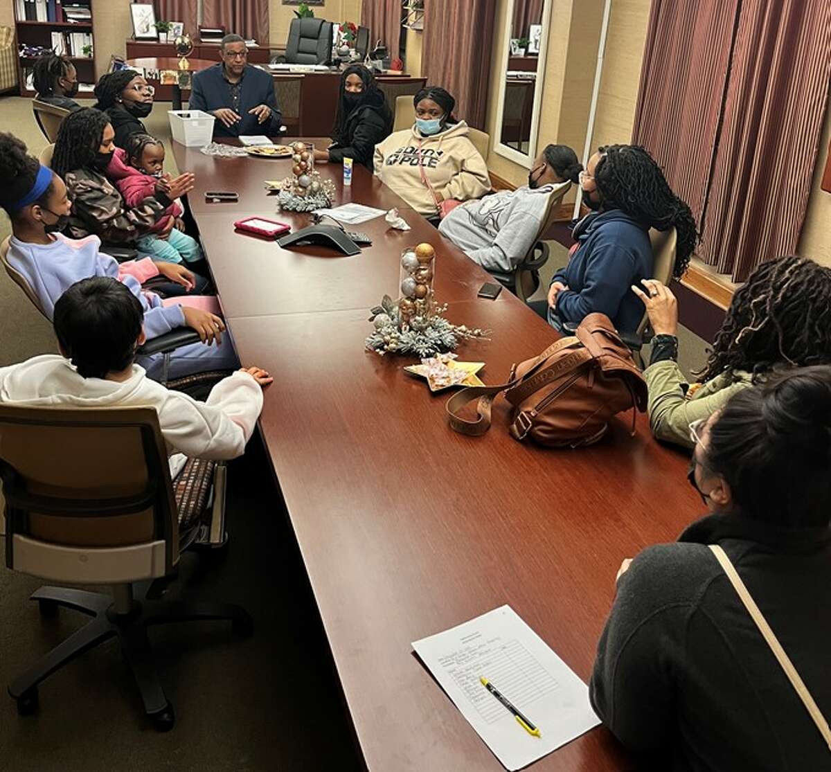 Be A Bridge nonprofit founder Marqueta Goins, and volunteer Amy Williams' girls group at Alton City Hall meeting with Alton Mayor David Goins, who's Marqueta Goins' father-in-law, to talk about adolescent youth needs in the community.